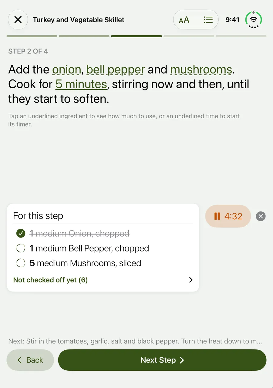 Cook Mode on a half-open iPhone Duo: the step at the top, the ingredients for this step, a running timer and the Back and Next buttons on the lower half